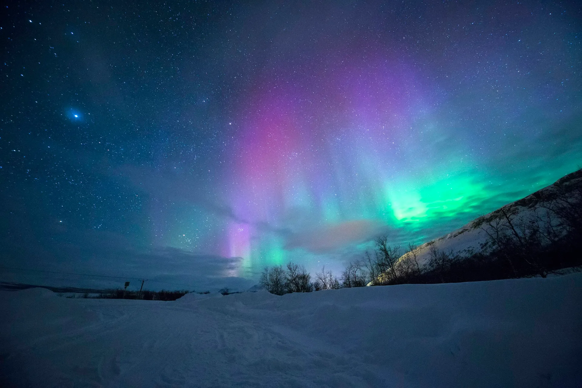 Aurora borealis dancing across Earth's atmosphere