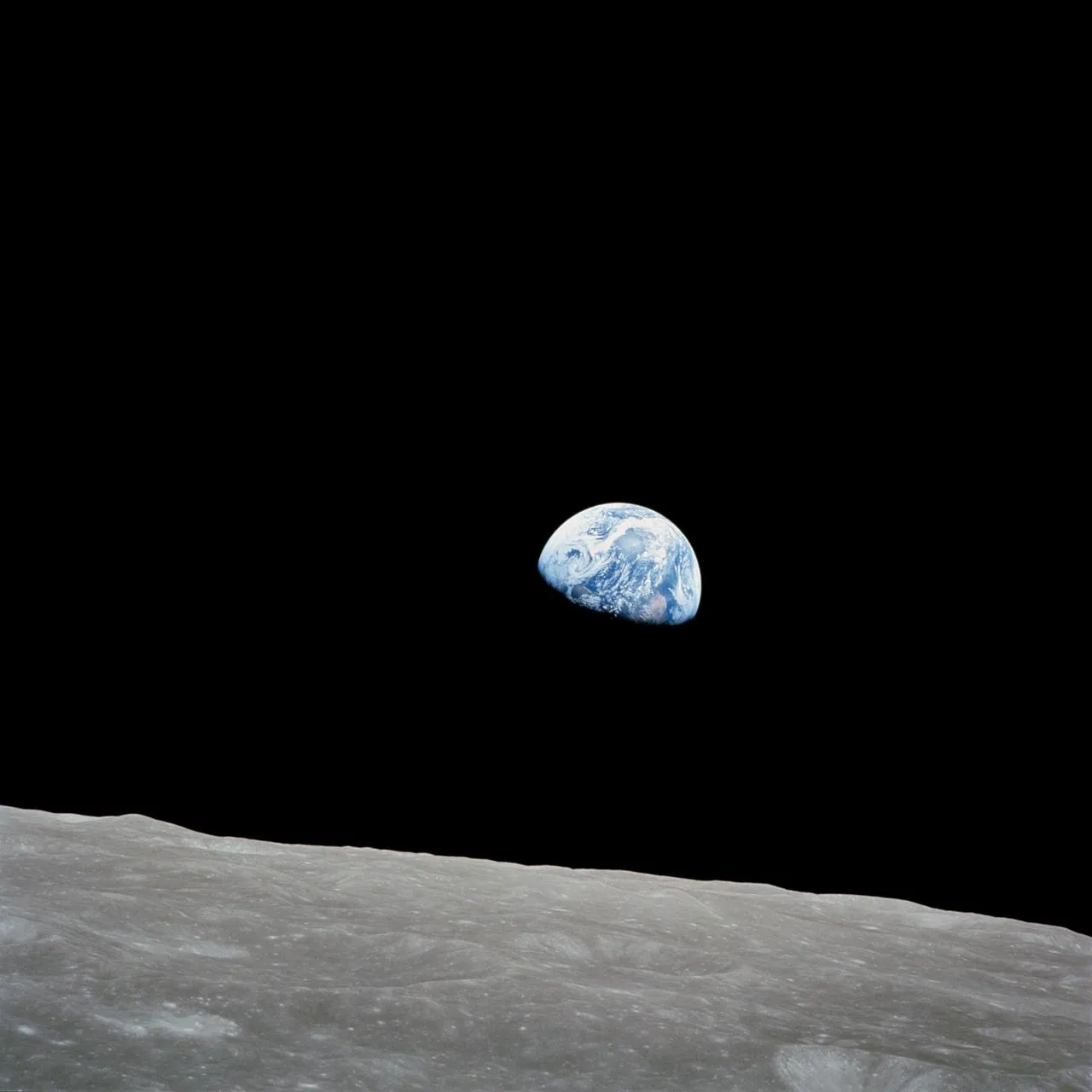 Earthrise as seen from Apollo — our planet rising above the lunar horizon