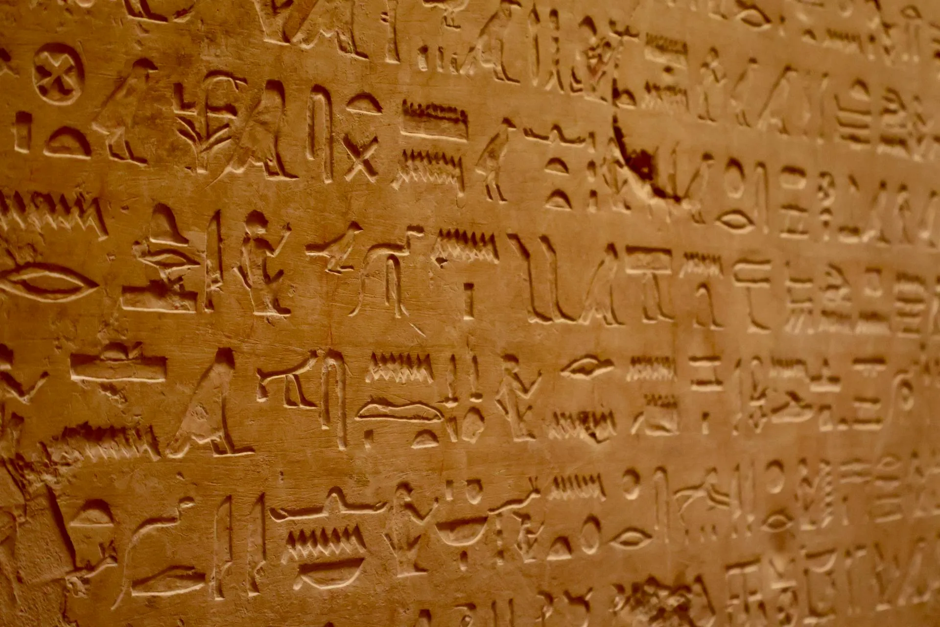 Stone tablet with ancient Egyptian hieroglyphs — knowledge carved into stone